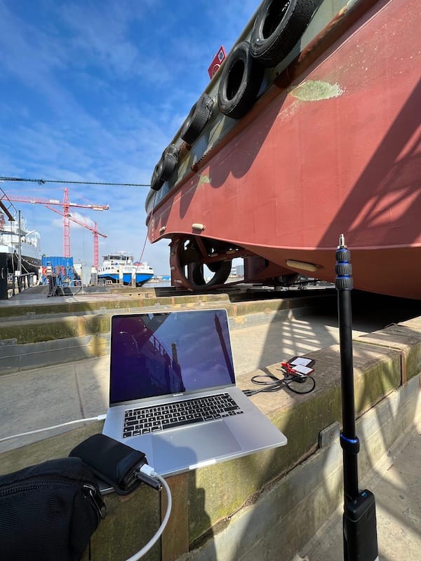 Dry dock photoshoot of a virtual vessel shooting a tugboat
